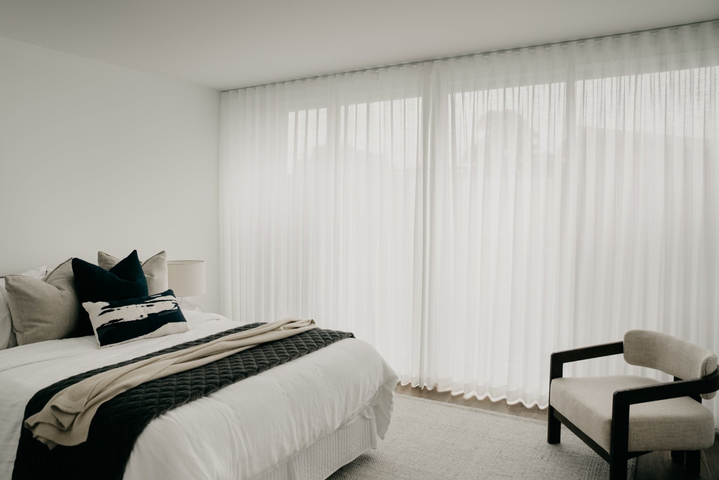 Bedroom with sheer curtains